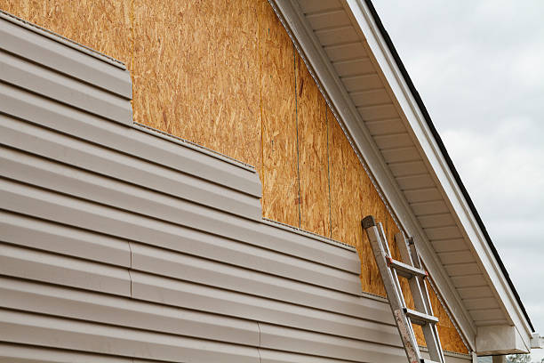 Professional Storm Damage Siding Repair technician working in New London, NC